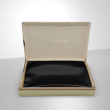 Luxurious black silk pillowcase from SilkSleek in elegant packaging for restful sleep