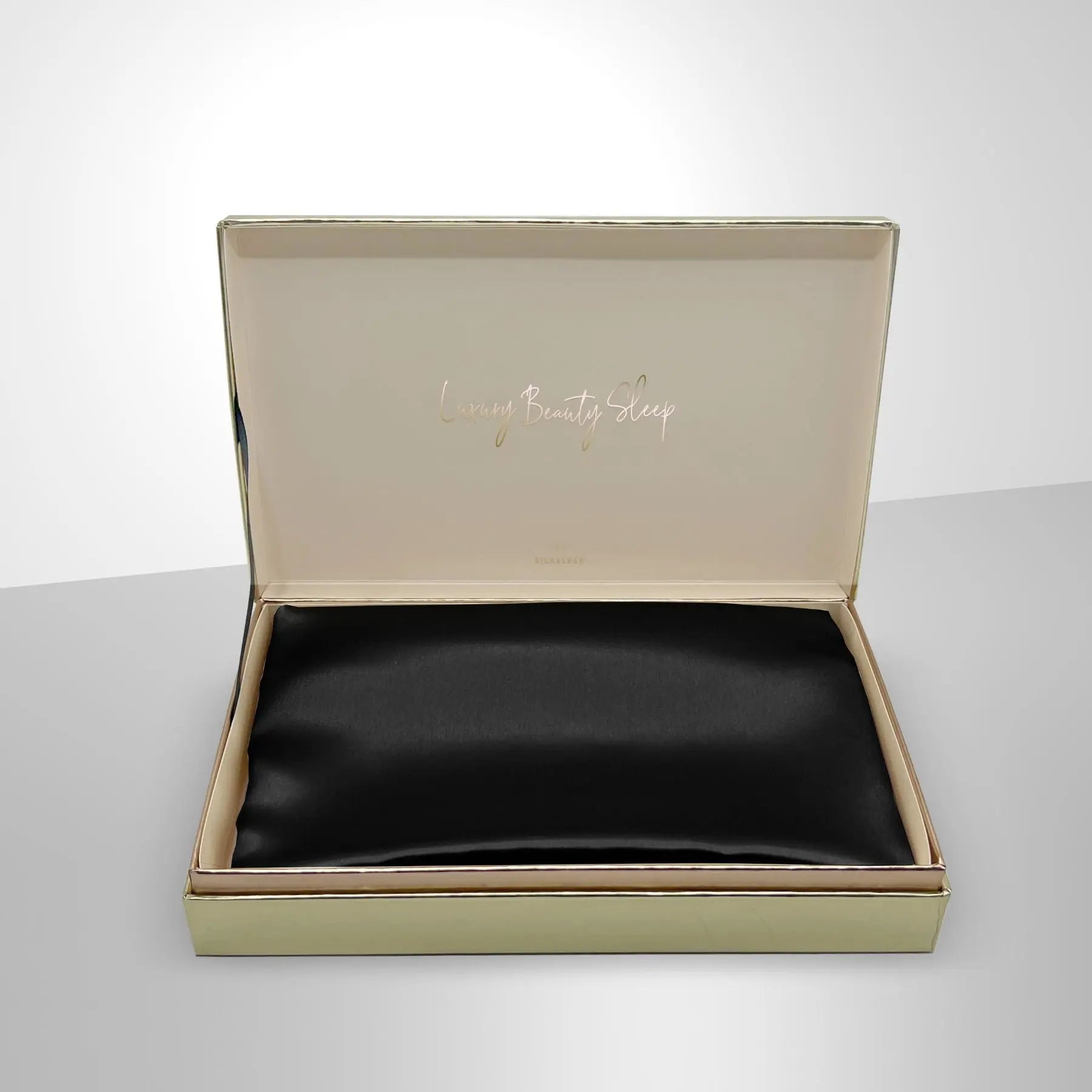 Luxurious black silk pillowcase from SilkSleek in elegant packaging for restful sleep
