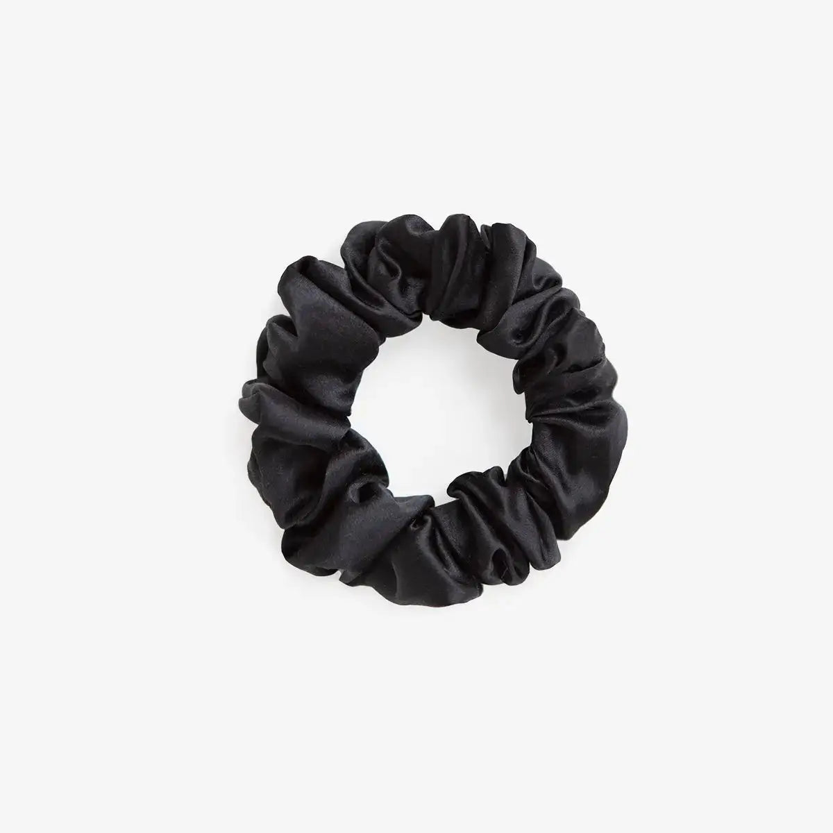 Black silk scrunchie on a white background