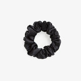Black silk scrunchie on a white background