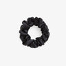 Black silk scrunchie on a white background