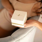 Woman Holding a Silk Scrunchies Gift Box 