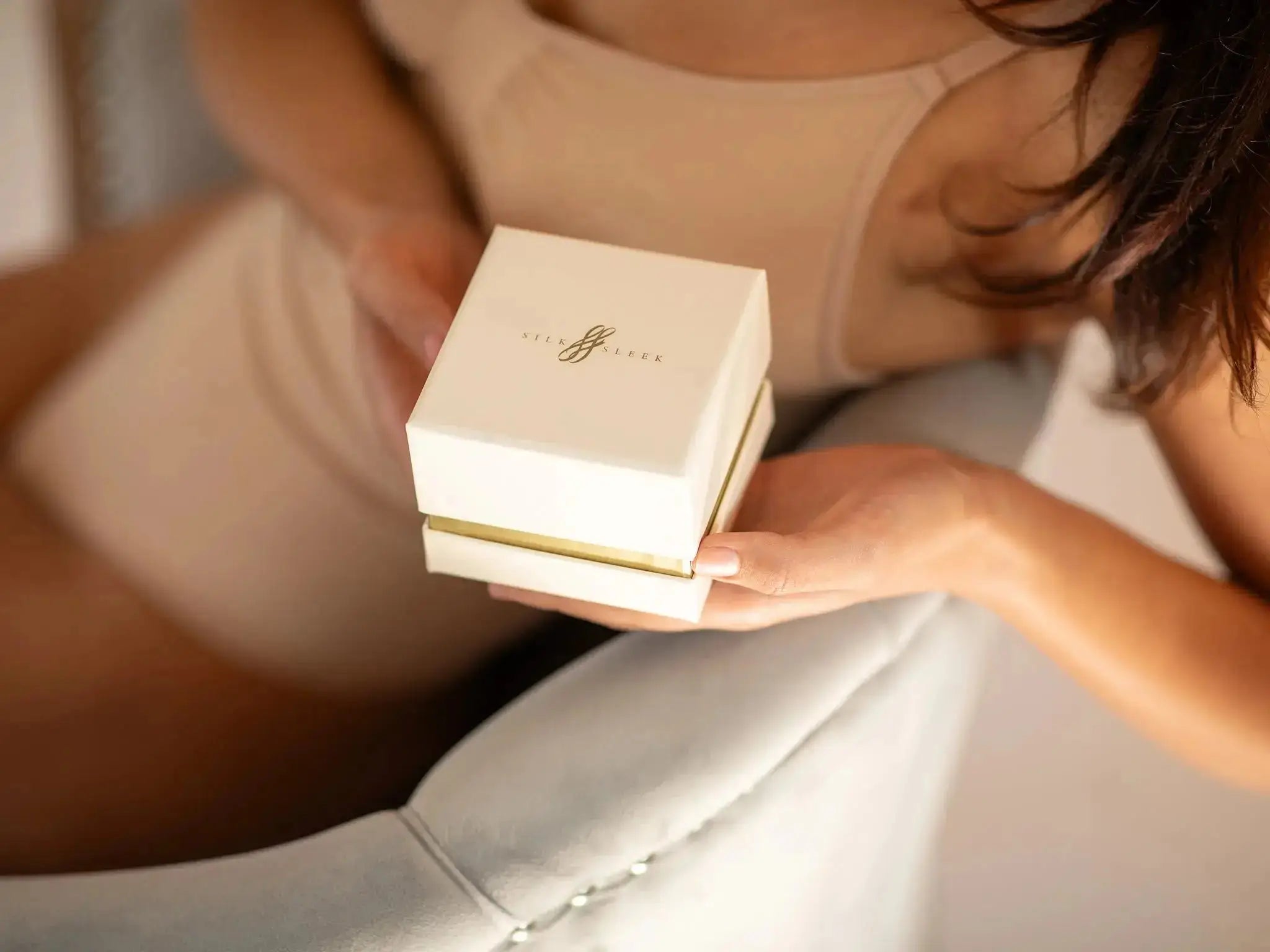 Woman Holding a Silk Scrunchies Gift Box 