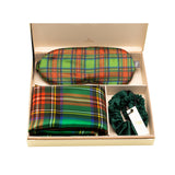 Mulberry silk plaid set with a matching eye mask, pillowcase and scrunchie arranged inside a gold gift box.