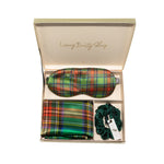 Green plaid silk eye mask, pillowcase, and scrunchie set in a box labeled 'Luxury Beauty Sleep'.
