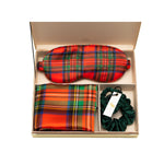 Set of Plaid Red Silk Sleep set with matching pillowcase, eye mask and emerald scrunchies displayed on a white background.