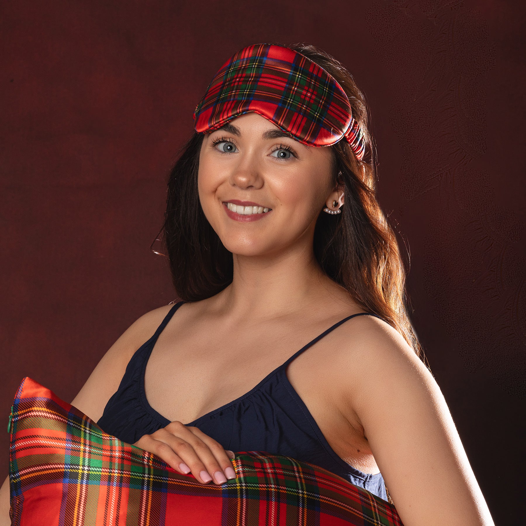 Woman wearing a tartan red plaid silk eye mask 