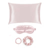 Gift Set of pink silk  pillowcase, eye mask,  and scrunchie on a white background