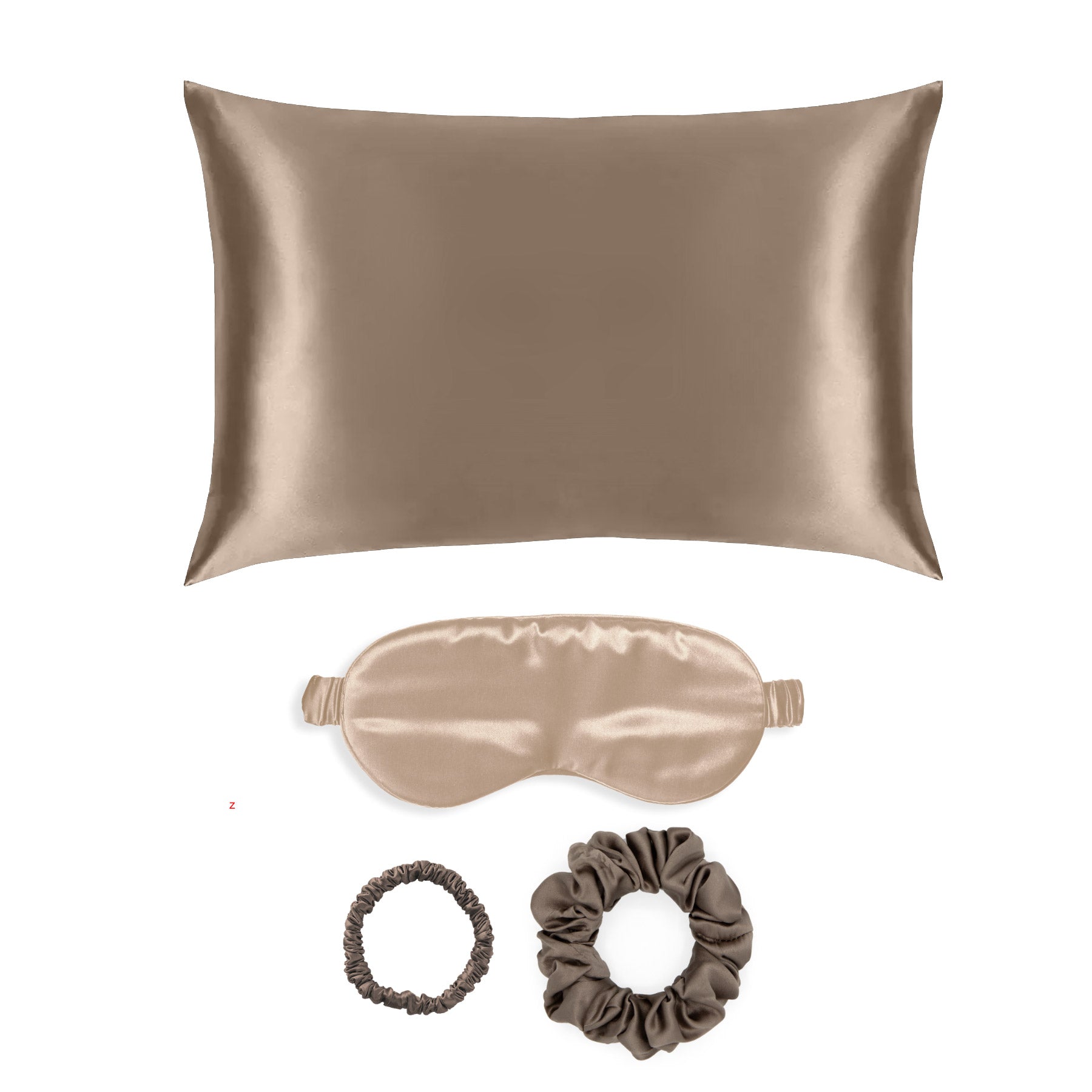 Set of  taupe silk pillowcase, eye mask, and hair ties on a white background